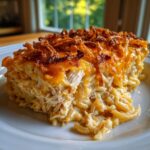 A close-up of a serving of creamy Monterey Chicken Spaghetti with a crispy, cheesy topping.